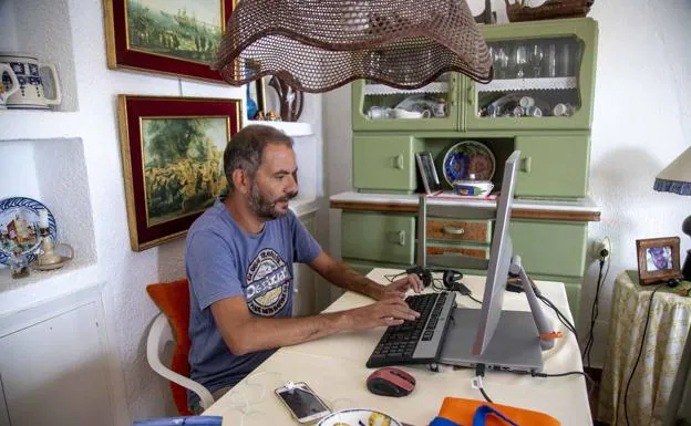 A man teleworking at home.