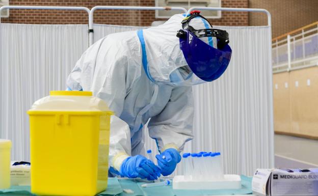 A health worker prepares diagnostic tests, in a file photo.