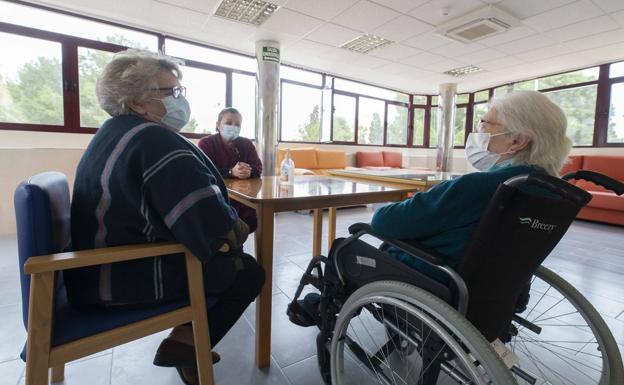 Relatives visit an elderly woman in a residence in the Region in a file image.