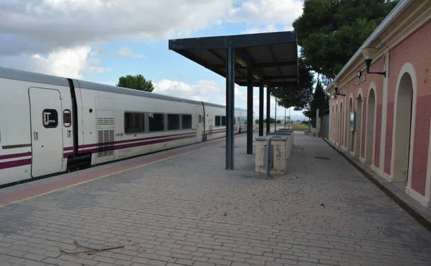 A train bound for Madrid passes through the Archena station.