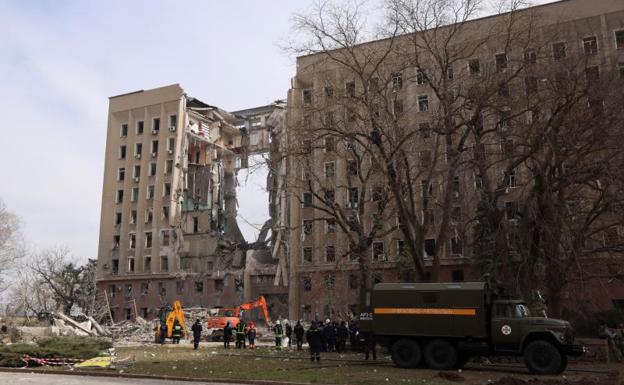 The missile attack caused a gaping hole in the center of the nine-story building.