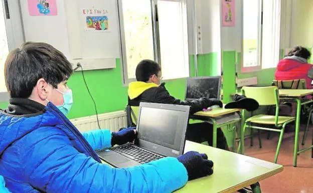 Secondary school students using computers in class, in a file image. 