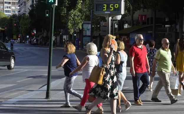 Several people walk through Murcia, in a file image. 