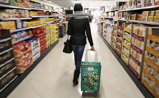 A woman does the shopping in a supermarket, in a file photograph.