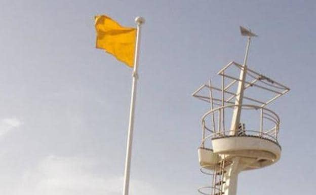 Yellow flag on a beach in the Region of Murcia.