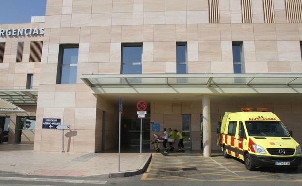An ambulance next to the entrance of the Santa Lucía hospital. 