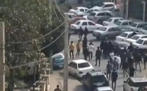 Iranian protesters chanting slogans march on a street in the northwestern city of Ardabil. 
