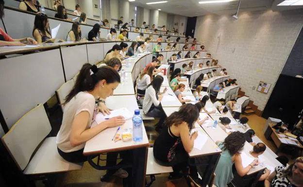 Students take an exam on a file image. 